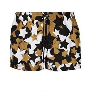 Men’s XS Dolce and Gabbana swim trunks with star design. Worn one time.